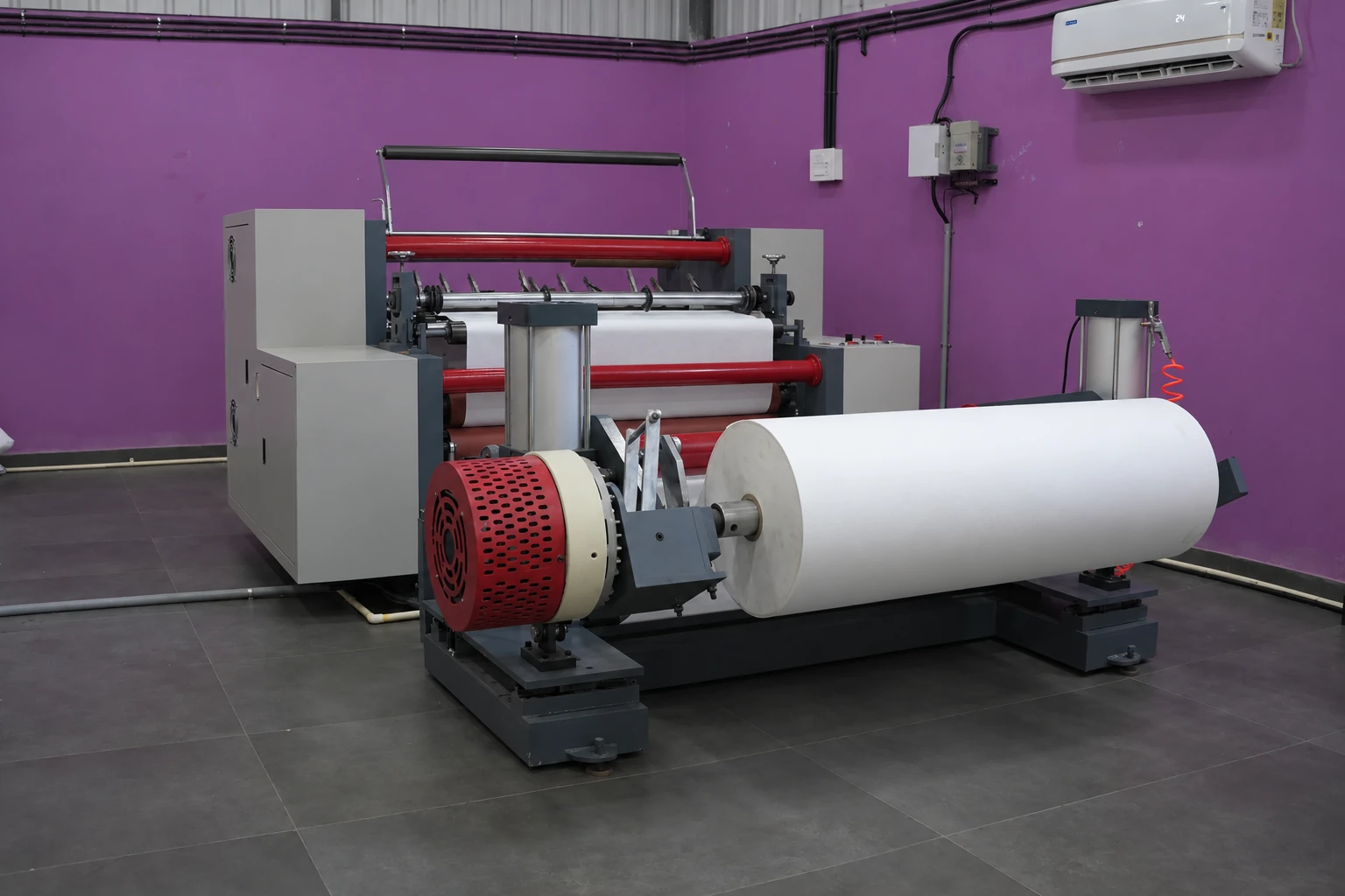 Slitting and rewinding equipment with a material roll